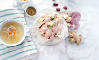Whole raw chicken on a board