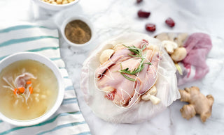 Whole raw chicken on a board