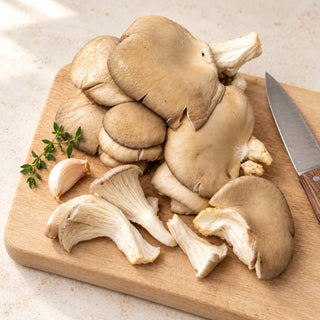 blue oyster mushroom preparation illustration on a clean chopping board; other ingredients and utensils are serving suggestions, not included