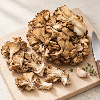 maitake preparation illustration on a clean chopping board; other ingredients and utensils are serving suggestions, not included